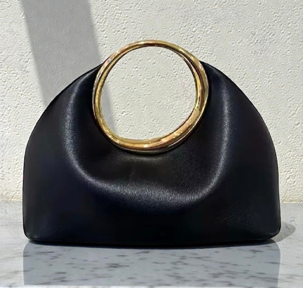 Luxury Sculpted Black Handbag with Gold Circular Handle – Modern Statement Top Handle Purse for Women
