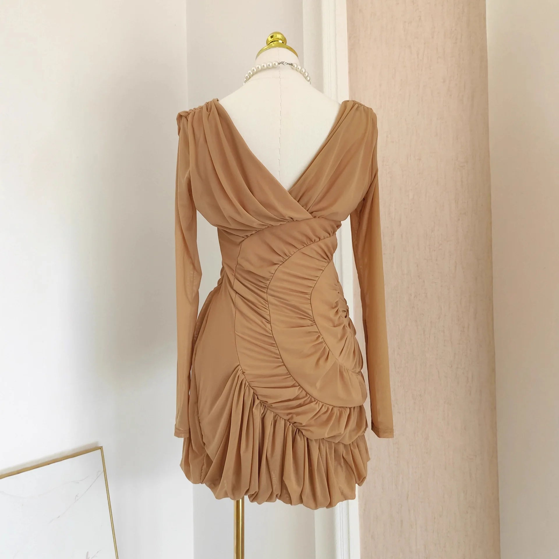 Luxury Nude Ruched Long Sleeve Mini Dress with V-Neck & Draped Detail | Modern Blend Boutique