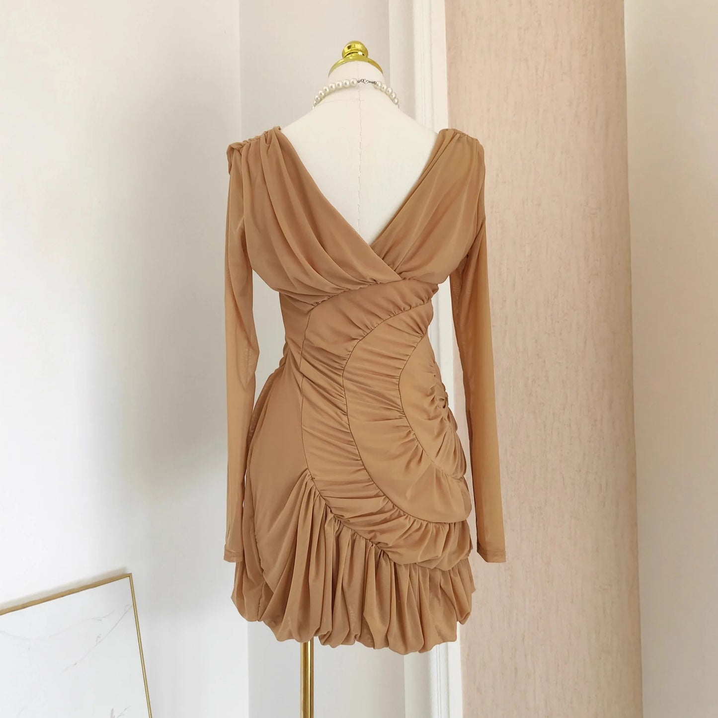 Luxury Nude Ruched Long Sleeve Mini Dress with V-Neck & Draped Detail | Modern Blend Boutique