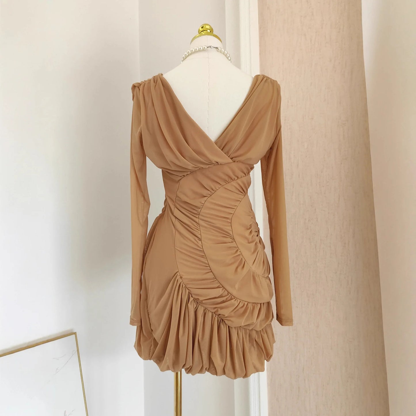 Luxury Nude Ruched Long Sleeve Mini Dress with V-Neck & Draped Detail | Modern Blend Boutique