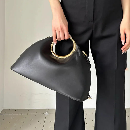 Luxury Sculpted Black Handbag with Gold Circular Handle – Modern Statement Top Handle Purse for Women