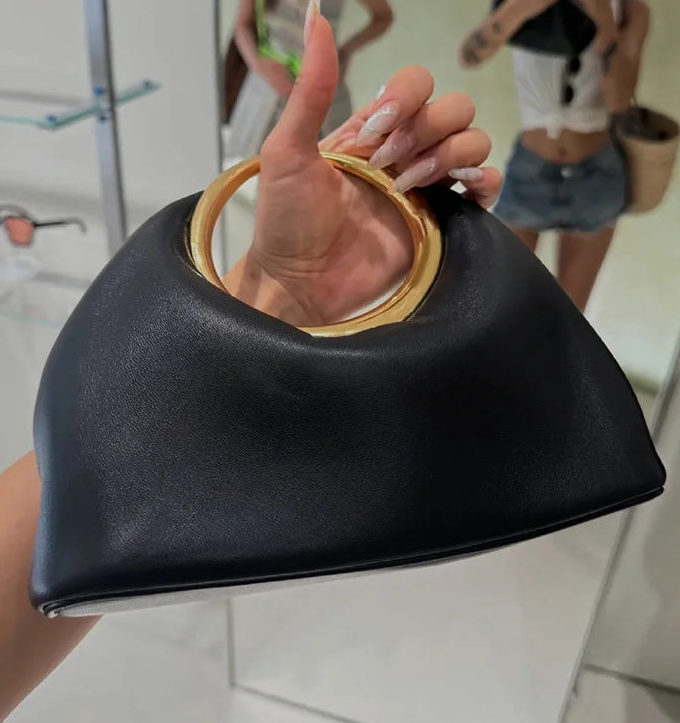 Luxury Sculpted Black Handbag with Gold Circular Handle – Modern Statement Top Handle Purse for Women