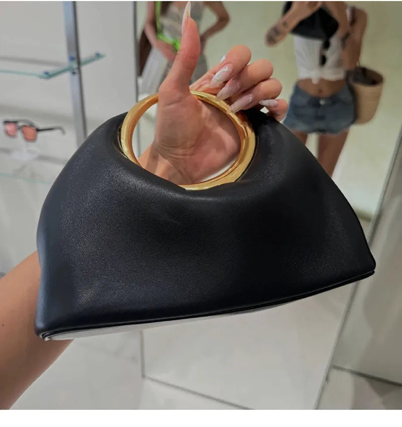 Luxury Sculpted Black Handbag with Gold Circular Handle – Modern Statement Top Handle Purse for Women