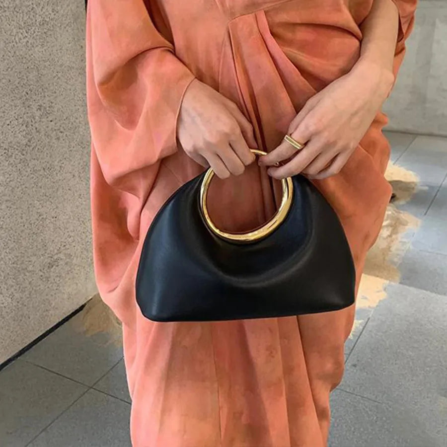 Luxury Sculpted Black Handbag with Gold Circular Handle – Modern Statement Top Handle Purse for Women